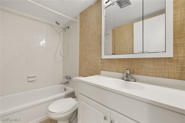 bathroom featuring visible vents, toilet, bathtub / shower combination, and vanity