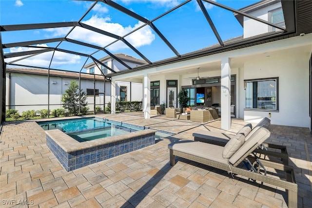 view of swimming pool with a patio area, a pool with connected hot tub, outdoor lounge area, and a ceiling fan