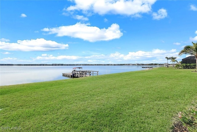 dock area featuring a yard and a water view