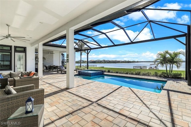 view of swimming pool featuring a water view, a ceiling fan, a pool with connected hot tub, an outdoor living space, and a patio area