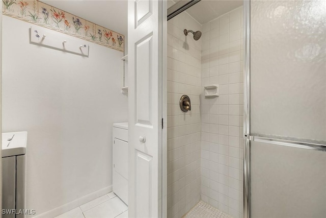 full bath with tile patterned flooring, baseboards, and a stall shower