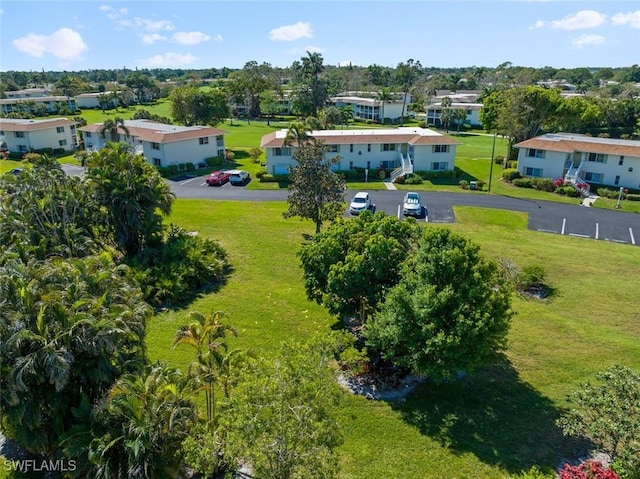 birds eye view of property with a residential view