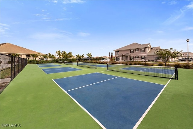 view of sport court featuring community basketball court and fence