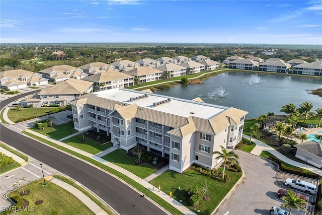 aerial view with a water view and a residential view