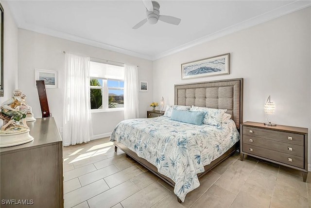 bedroom with ornamental molding and a ceiling fan