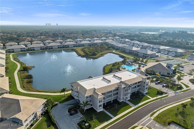 birds eye view of property with a residential view and a water view