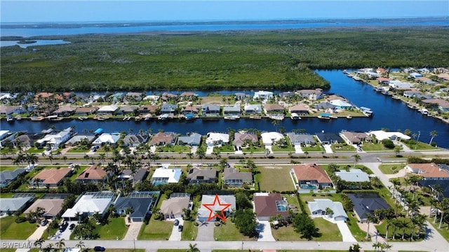 drone / aerial view featuring a water view and a residential view