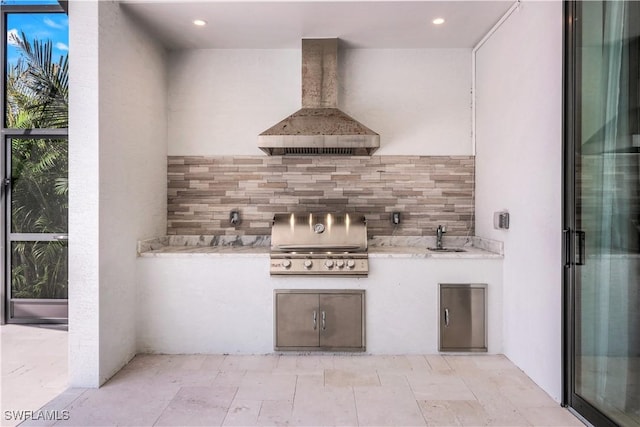 view of patio / terrace featuring an outdoor kitchen, a grill, and a sink