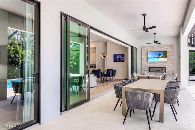 view of patio with ceiling fan and outdoor lounge area