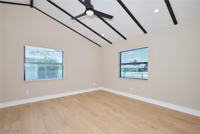 spare room with ceiling fan, baseboards, beam ceiling, wood finished floors, and high vaulted ceiling