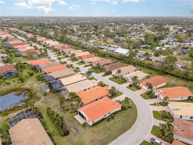 aerial view featuring a residential view and a water view