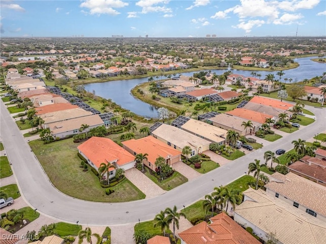 aerial view with a residential view and a water view