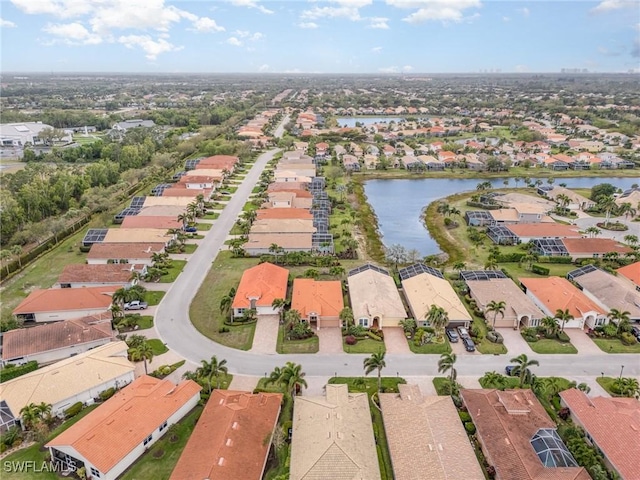 birds eye view of property with a residential view and a water view