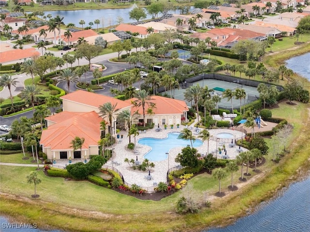 bird's eye view featuring a residential view and a water view