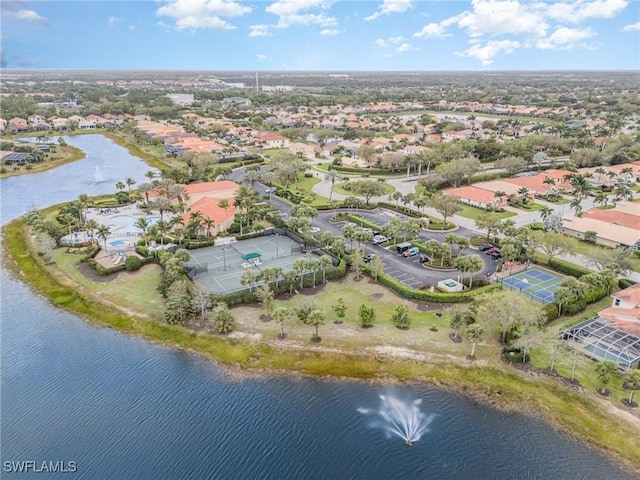 birds eye view of property featuring a residential view and a water view