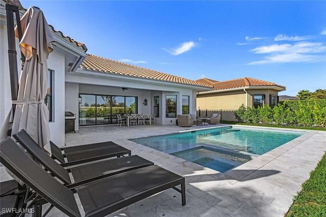 view of swimming pool featuring fence, a fenced in pool, area for grilling, outdoor lounge area, and a patio area