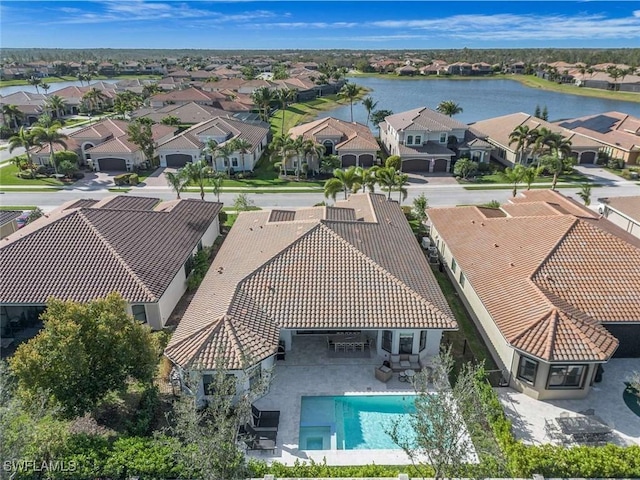 bird's eye view featuring a residential view and a water view