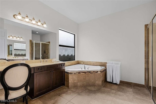 full bathroom with vanity, a shower stall, a bath, and tile patterned floors