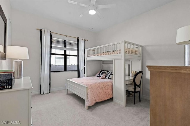 bedroom with baseboards, light carpet, and ceiling fan