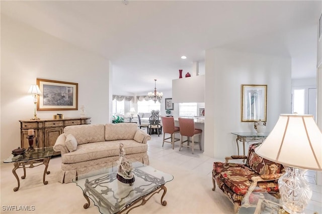 tiled living area with a notable chandelier and recessed lighting