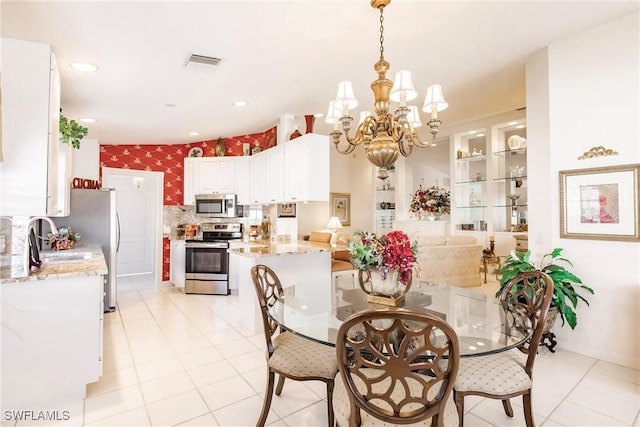 dining area featuring visible vents, wallpapered walls, recessed lighting, an inviting chandelier, and light tile patterned flooring