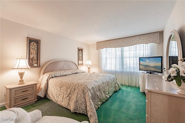 bedroom featuring dark carpet