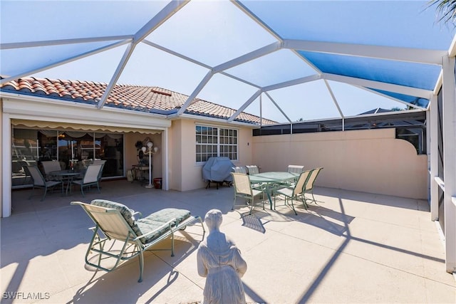 view of patio / terrace with a lanai and outdoor dining space