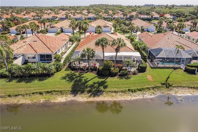 aerial view with a residential view and a water view