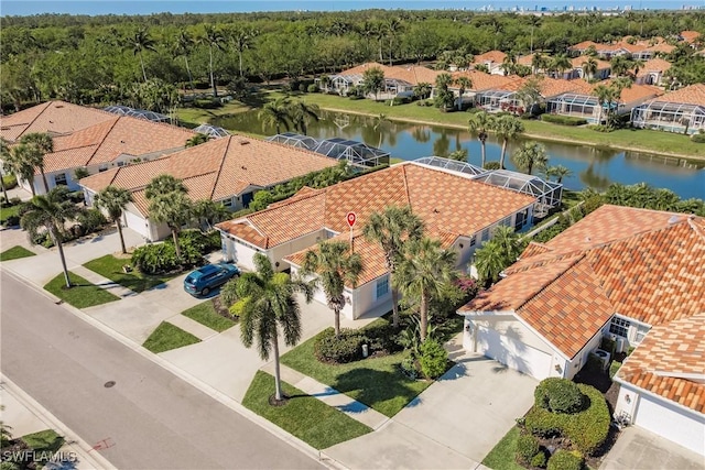 aerial view featuring a residential view and a water view