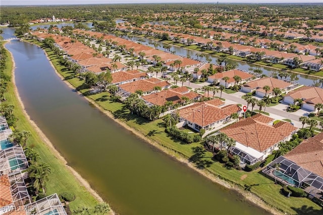 aerial view with a residential view and a water view