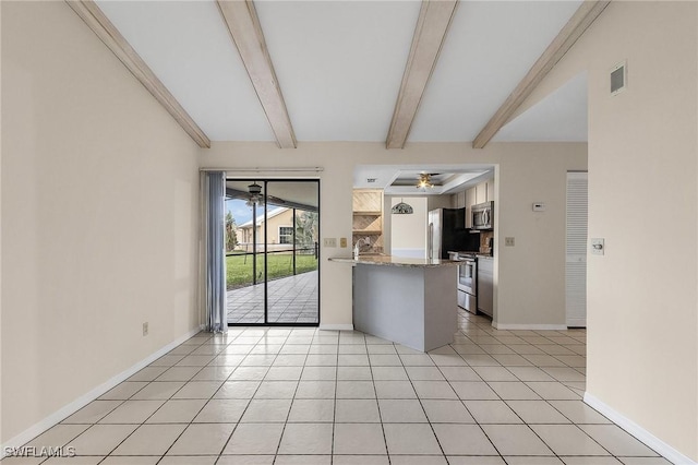 kitchen with visible vents, a ceiling fan, stainless steel appliances, a peninsula, and light tile patterned floors