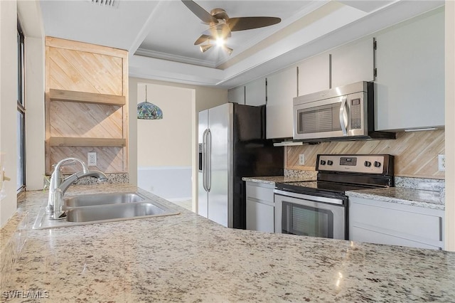 kitchen with ornamental molding, a sink, open shelves, backsplash, and appliances with stainless steel finishes