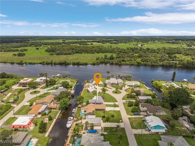 birds eye view of property featuring a residential view and a water view