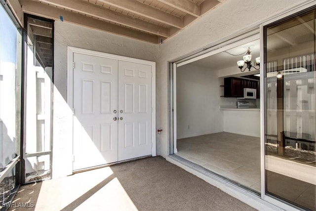 property entrance featuring stucco siding