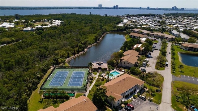 birds eye view of property with a water view