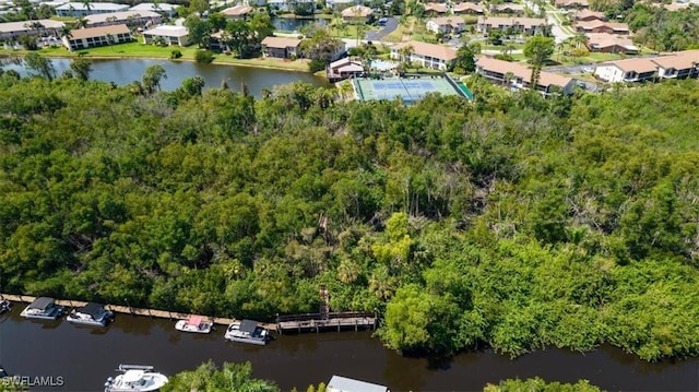 birds eye view of property with a residential view and a water view