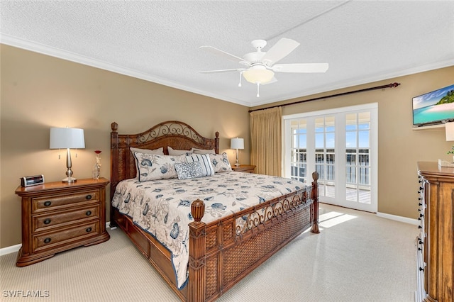 carpeted bedroom with a textured ceiling, access to outside, baseboards, and ornamental molding