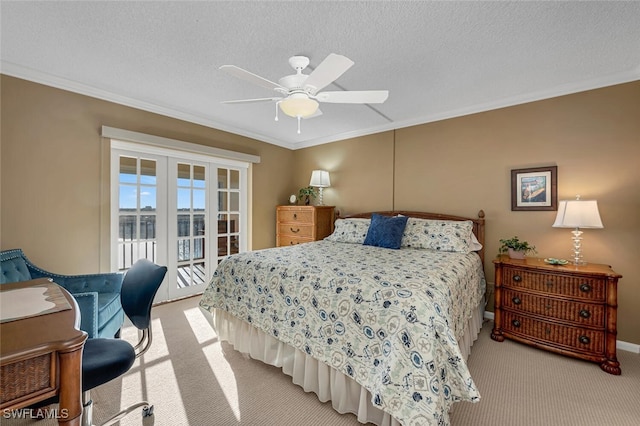 bedroom featuring a textured ceiling, crown molding, and light carpet