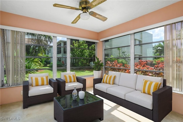 sunroom featuring a ceiling fan