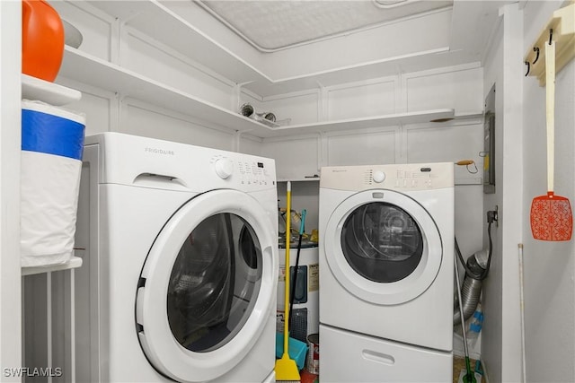 laundry area featuring washer and dryer and laundry area