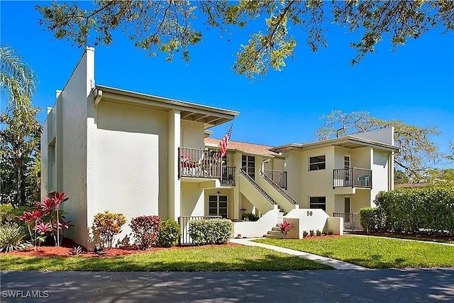 view of property featuring stairs