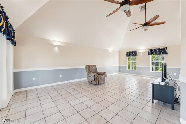 living area with light tile patterned floors, visible vents, baseboards, and high vaulted ceiling