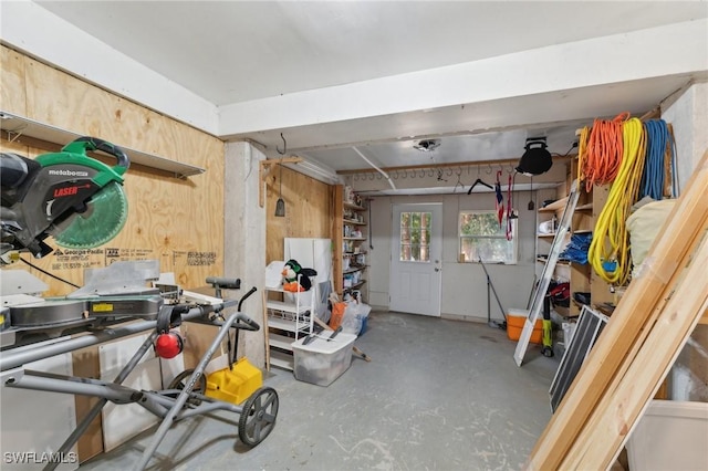 garage featuring wooden walls