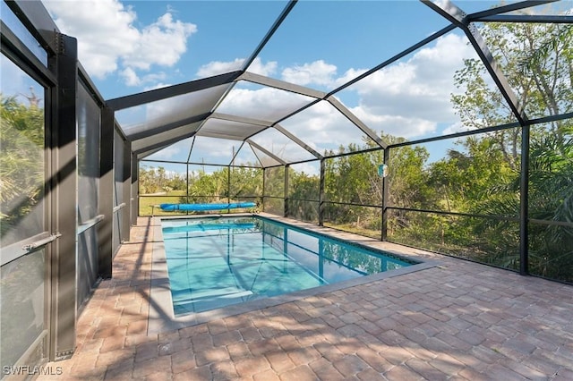 pool featuring a patio area and a lanai