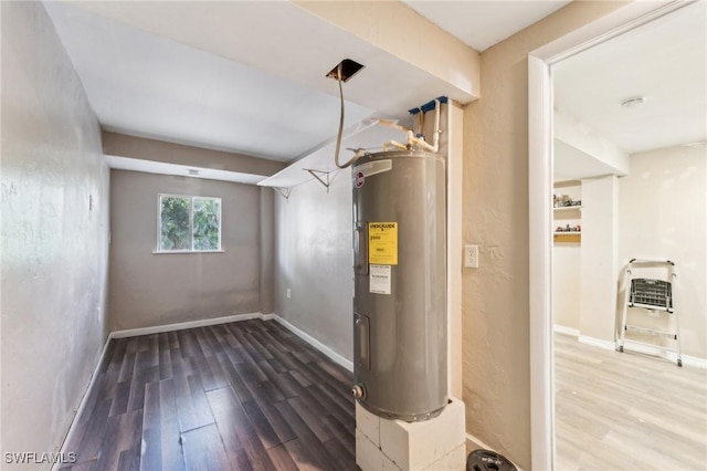 utility room with water heater and heating unit