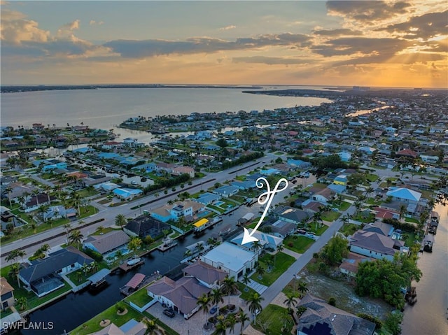 836 Miramar Ct, Cape Coral, FL 33904 - aerial view at dusk with a water view and a residential view