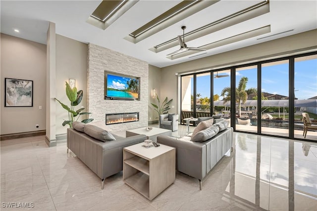 836 Miramar Ct, Cape Coral, FL 33904 - living area featuring a stone fireplace, baseboards, and marble finish floor