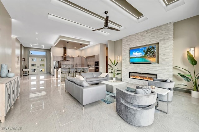 836 Miramar Ct, Cape Coral, FL 33904 - living area featuring recessed lighting, french doors, a large fireplace, and marble finish floor