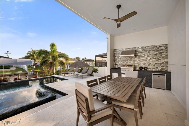 836 Miramar Ct, Cape Coral, FL 33904 - view of patio with area for grilling, outdoor dining space, exterior kitchen, a fenced in pool, and ceiling fan
