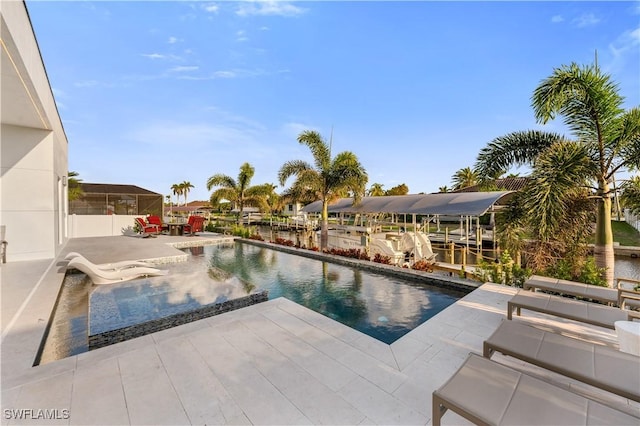 836 Miramar Ct, Cape Coral, FL 33904 - view of pool featuring a patio area, a dock, and boat lift
